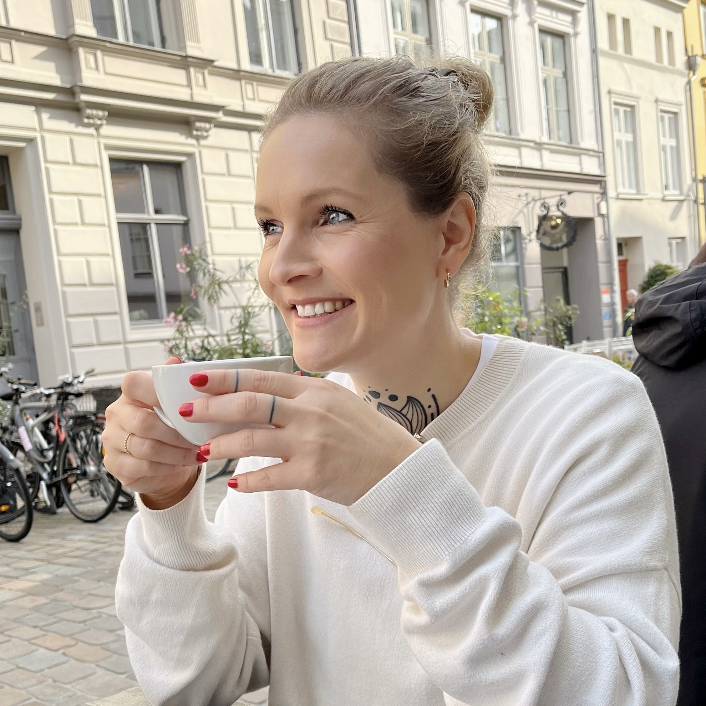 Victoria drinking coffee in Lübeck